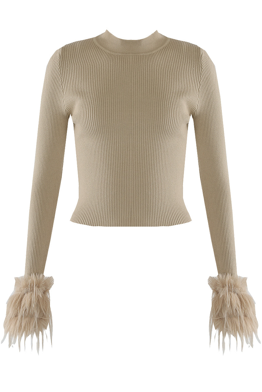 Beige ribbed sweater with fringed cuffs on a white background