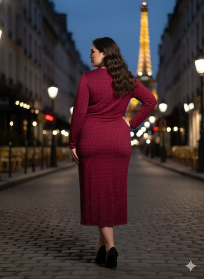 Woman in a red dress standing on a street with the Eiffel Tower in the background