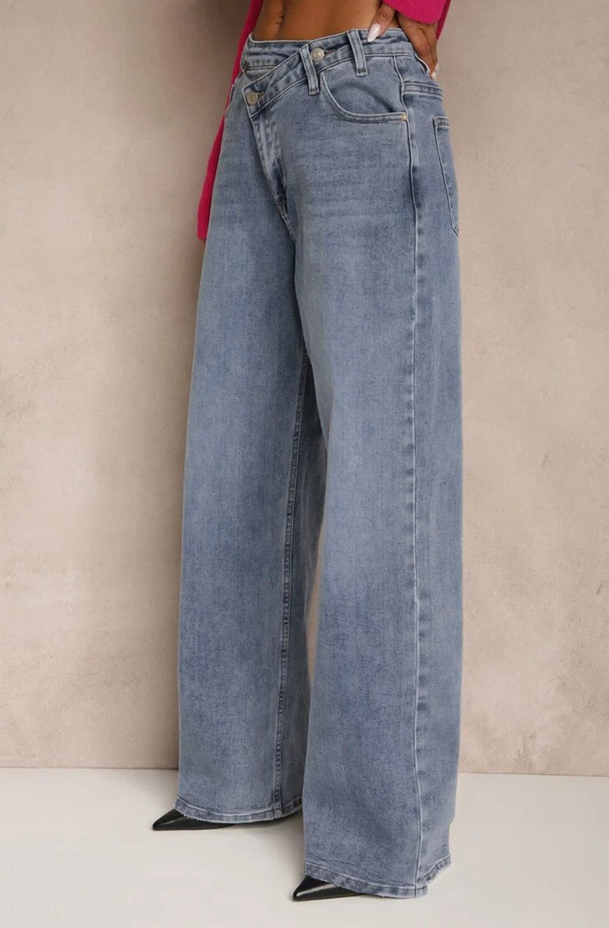 Wide-leg jeans worn by a person against a neutral background